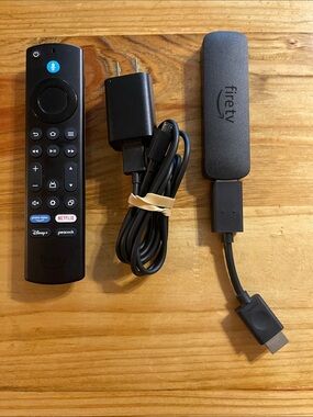 Amazon Fire TV Stick Lite in black with USB power cable